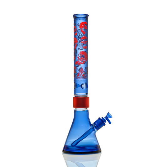 Prism x Milkyway SKULLIANCE Sapphire Classic Beaker bong with blue glass, red Prism Halo, and red etched skull artwork on a tall Classic mouthpiece.