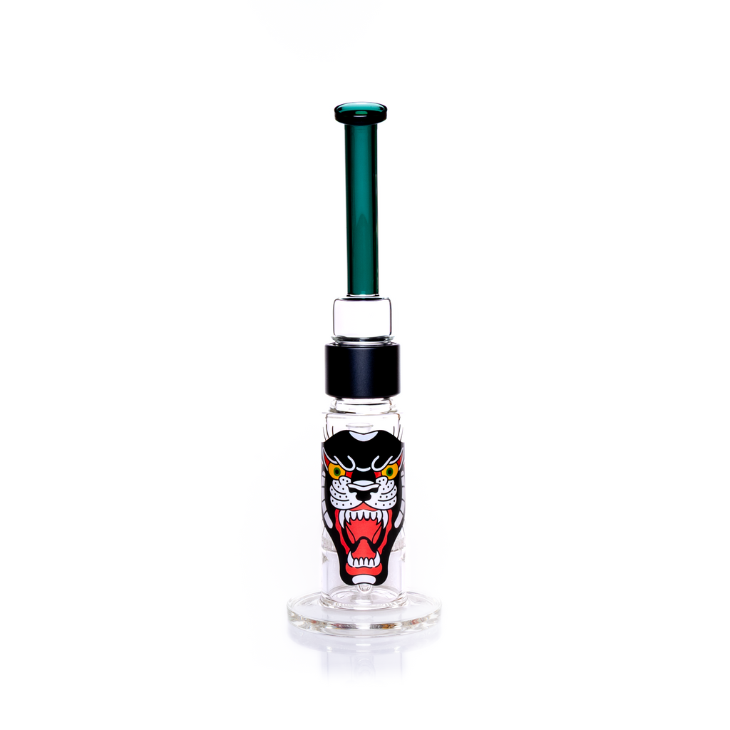 Back view of the Prism honeycomb glass water pipe featuring a large, central panther graphic on the base. The illustration is a vibrant tattoo-style design that wraps the thick borosilicate honeycomb pipe. Image highlights the dual-disc filtration system and the connection between the black anodized aluminum fitting and the bent teal top section. Includes the clear 18mm slide joint for a dry herb accessory. Customizable easy clean water pipe for collectors.