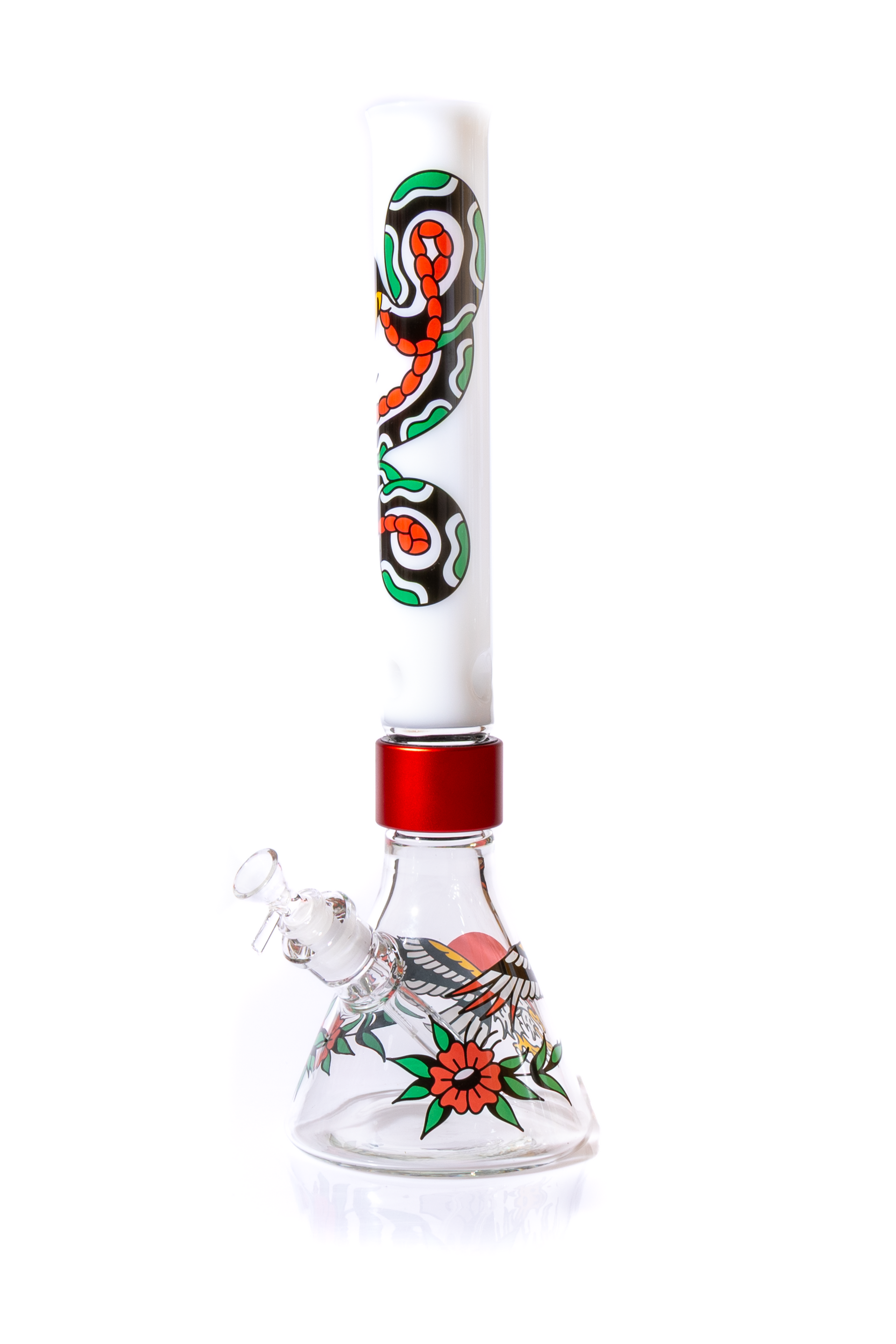 Affordable modular glass bong with American Traditional tattoo decals. The Prism Inked Beaker Single Stack features thick borosilicate glass construction and easy-clean threaded joints. Image shows the assembled piece with a clear beaker base, eagle and flower decal, and a red halo connector. The Tall mouthpiece is white with a snake tattoo decal. Includes clear dry herb bowl and downstem. Customizable water pipe for easy cleaning and budget-friendly setup.