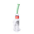 Glass water pipe with a green straw and red base on a white background