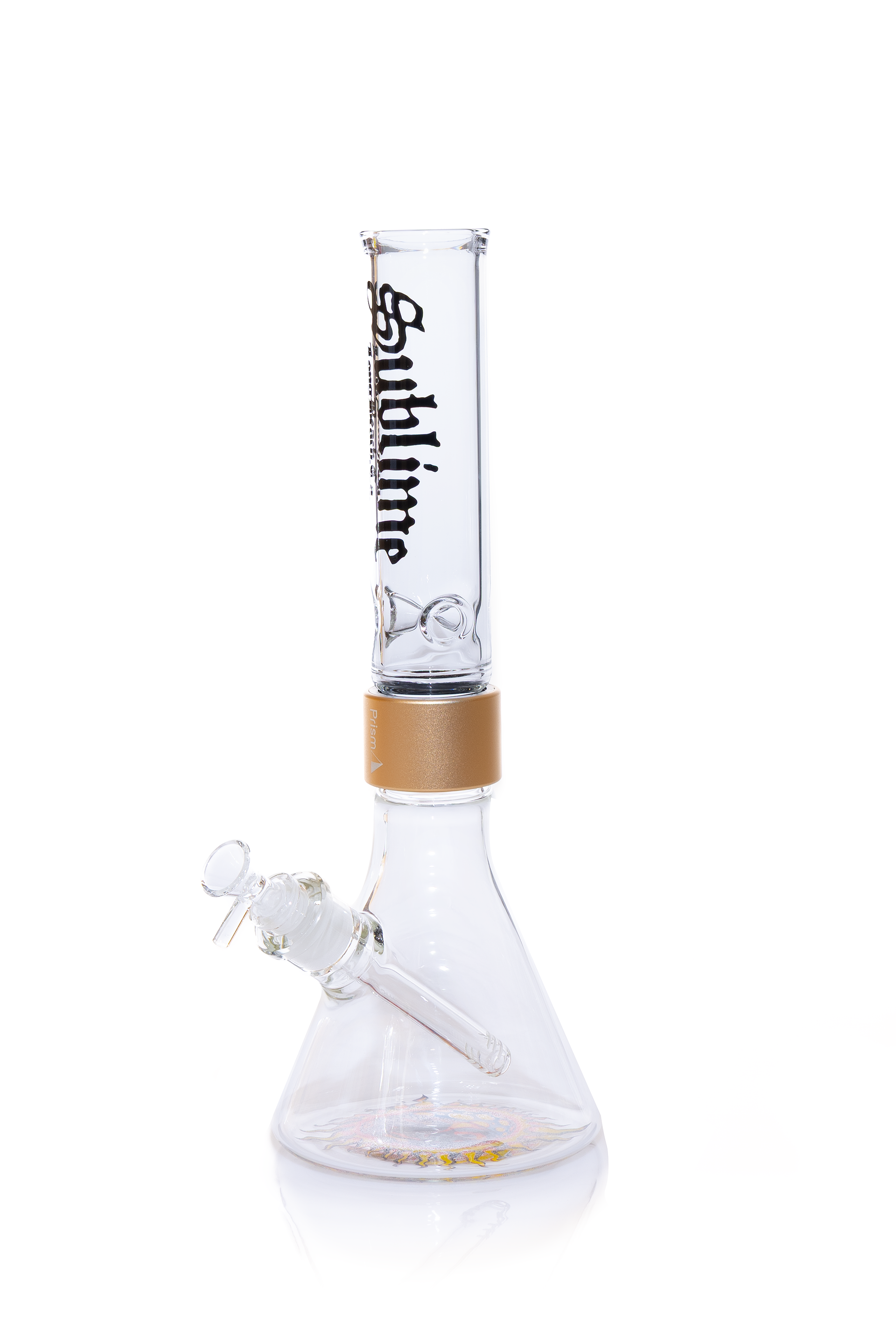 A fully assembled Prism x Sublime official clear glass modular beaker bong. The transparent design offers a clean look, showcasing the gold Halo Connector and the iconic yellow sun logo on the base. The clear glass mouthpiece features the black Sublime gothic logo, emphasizing the "Long Beach, California" roots of the band.