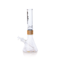 Official Sublime band clear beaker water pipe by Prism, showcasing a 360-degree decal design. The clear mouthpiece features the black gothic "Long Beach California" logo, connected to a clear glass base by a metallic gold anodized ring. This modular setup emphasizes the high-clarity glass and professional finish of this official band collaboration.