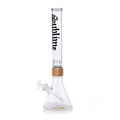 A professional studio shot of the Tall Clear Beaker from the Prism x Sublime collection. This piece emphasizes the modularity and scale of the collaboration, offering an oversized version of the classic beaker design. The clear glass allows for full visibility of the iconic band artwork and the sleek gold hardware, making it a standout collectible for Sublime fans and glass enthusiasts.