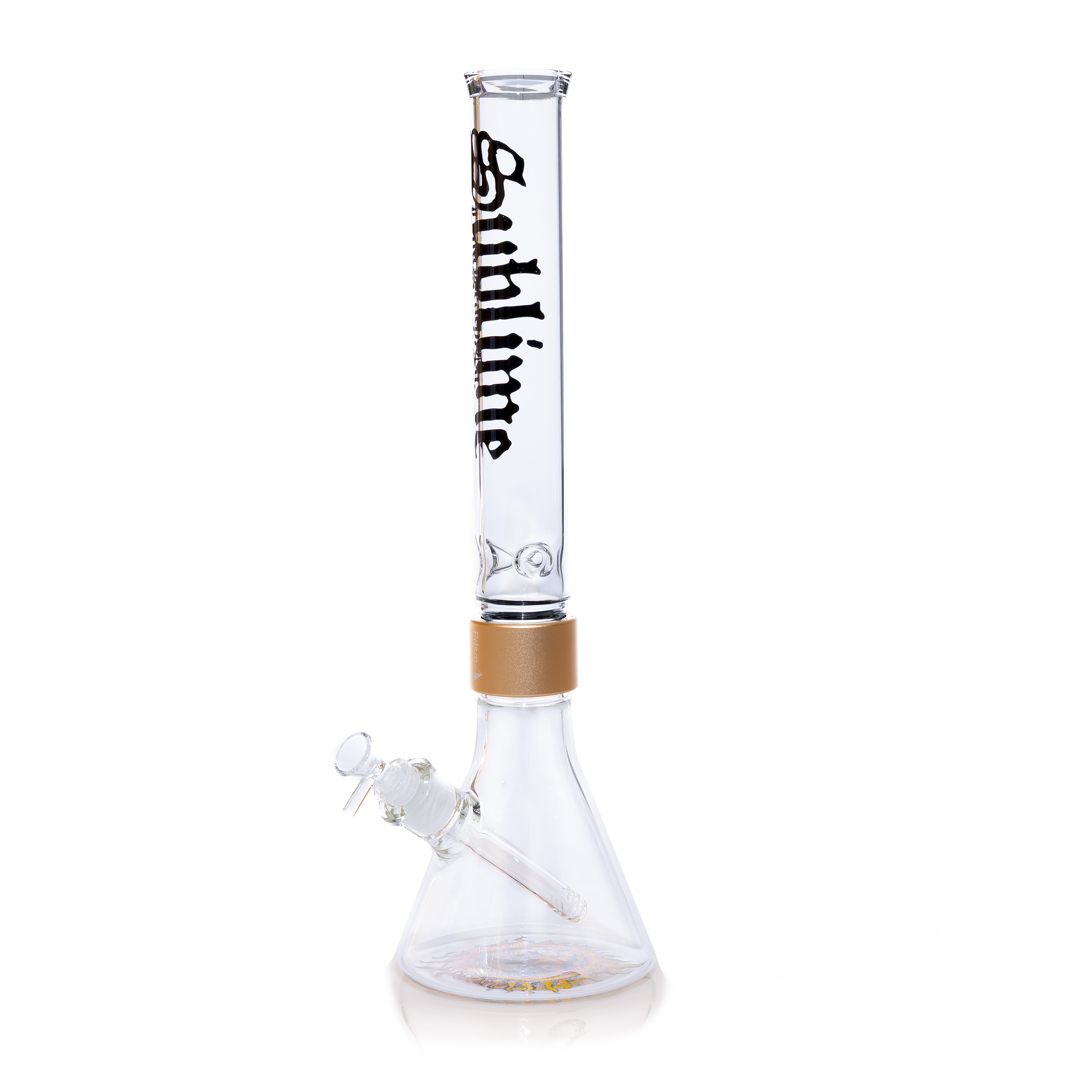 A professional studio shot of the Tall Clear Beaker from the Prism x Sublime collection. This piece emphasizes the modularity and scale of the collaboration, offering an oversized version of the classic beaker design. The clear glass allows for full visibility of the iconic band artwork and the sleek gold hardware, making it a standout collectible for Sublime fans and glass enthusiasts.