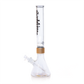 Back view of the Prism x Sublime official clear modular water pipe. This image emphasizes the high-clarity borosilicate glass and the seamless decal wrap of the "Sublime Long Beach" branding. Featuring a metallic gold Halo Connector, this collectible glass piece is designed for fans seeking authentic, high-end Sublime merchandise with a minimalist clear aesthetic.